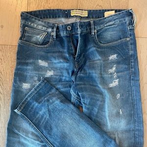 Scotch & soda lightly distressed blue jeans.